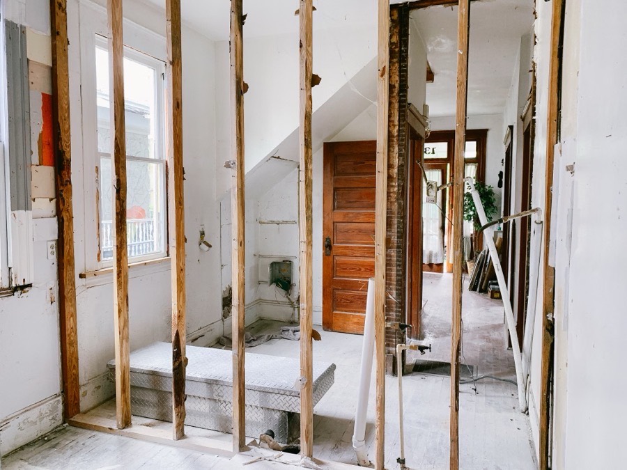 A room stripped back to its wall studs during renovation.